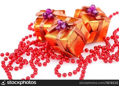 Christmas boxes and beads isolated on white background.