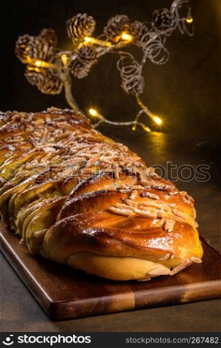 Christmas braided cinnamon cake on festive table.