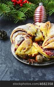Christmas bun for tea. tray of baked Christmas baking background with Christmas tree and decorations
