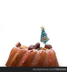 Christmas cake donut with tree as festive decoration on top over white background