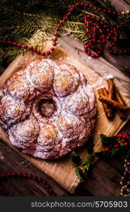 Christmas cake on wooden background