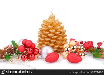 Christmas candle, balls and fir tree branches isolated on white background.