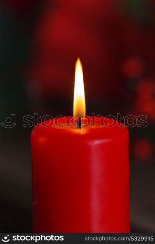 Christmas candle in red. Decoration for holidays
