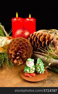 christmas candle with pine cone