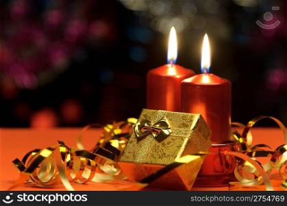 Christmas candles and gift boxes. A celebratory composition