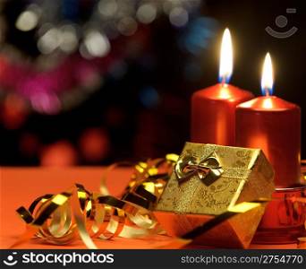 Christmas candles and gift boxes. A celebratory composition