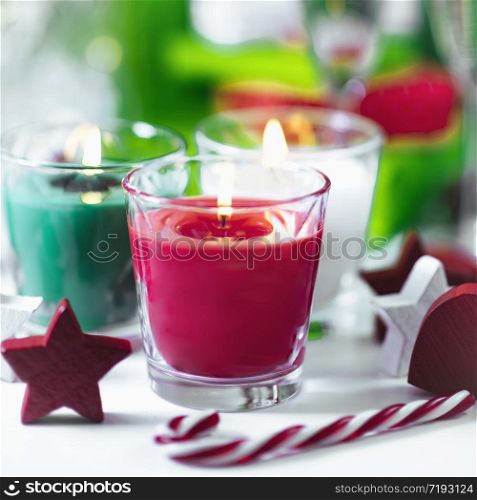 Christmas candles. Decorative red and green candles with ornaments . Christmas Candles. Decorative Red and Green Candles with Ornaments