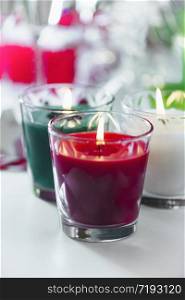 Christmas Candles. Decorative red, green and white candles. Copy space. Christmas Candles. Decorative Red, Green and White Candles