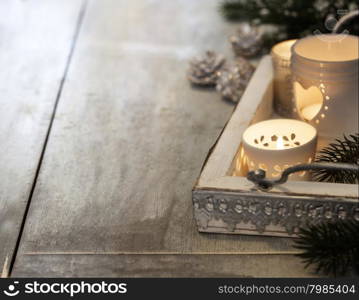 Christmas candles on wooden background. Christmas background