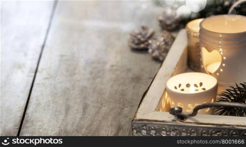 Christmas candles on wooden background. Christmas background