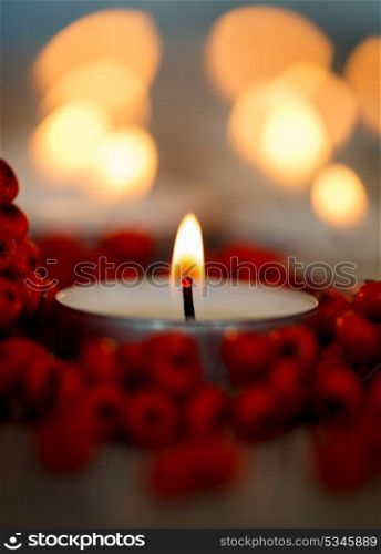 Christmas candles with berries. Decoration for holidays