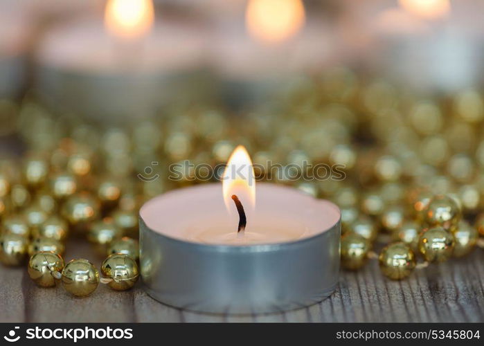 Christmas candles with golden decoration. Warm holidays