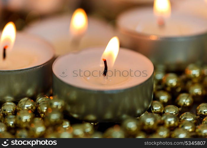 Christmas candles with golden decoration. Warm holidays