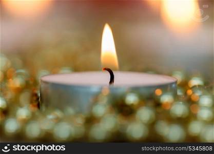 Christmas candles with golden decoration. Warm holidays