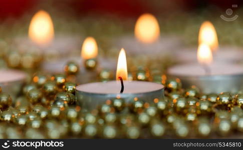 Christmas candles with golden decoration. Warm holidays