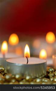 Christmas candles with golden decoration. Warm holidays