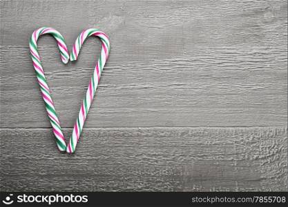 Christmas candy cane on wooden vintage table
