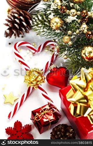 Christmas Candy Canes and decorations over white