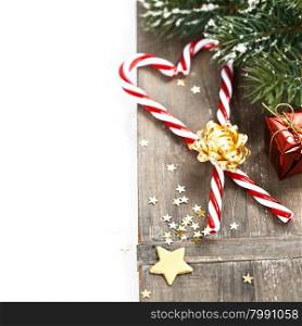 Christmas Candy Canes and decorations over white
