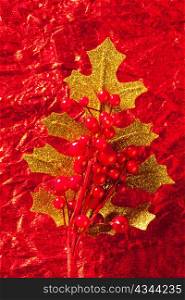 Christmas card of golden leaf and red berries