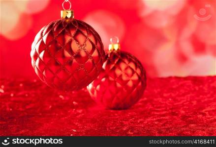 Christmas card of red capiton bauble on blurred background