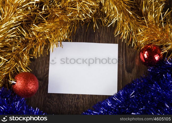 Christmas card. White blank card with decoration balls and tinsel. Place for text