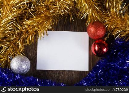 Christmas card. White blank card with decoration balls and tinsel. Place for text