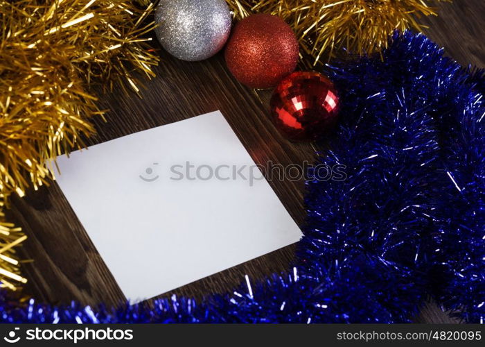 Christmas card. White blank card with decoration balls and tinsel. Place for text