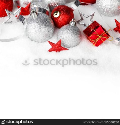 Christmas card with beautiful red and silver decorations in snow