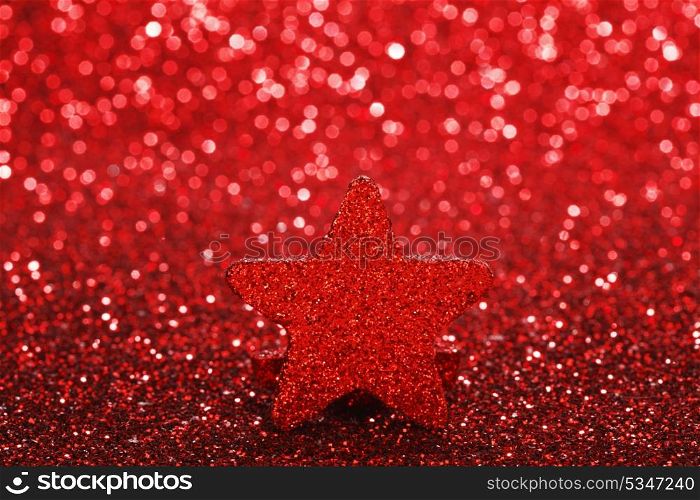 Christmas card with beautiful shiny decorative star over red background