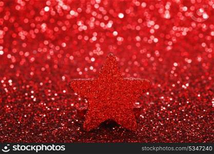 Christmas card with beautiful shiny decorative star over red background
