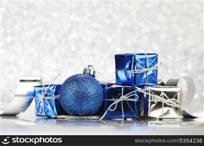 Christmas card with blue decoration on silver background