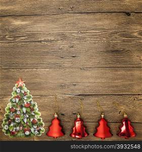 Christmas card with Christmas balls, Christmas tree on wooden background.