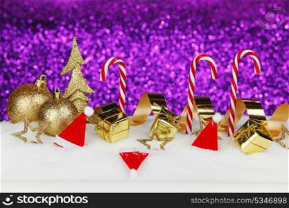 Christmas card with colorful decoration over purple background