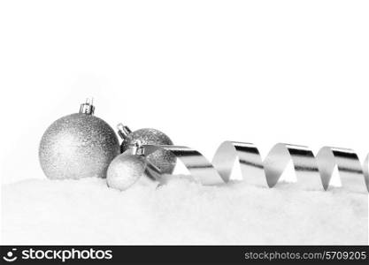 Christmas card with decorative baubles on snow