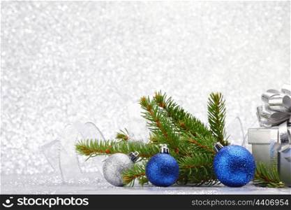 Christmas card with fir branch and colorful decoration