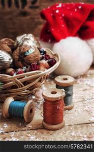 Christmas card with nuts,Christmas decorations and spools of thread
