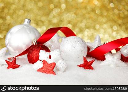 Christmas card with white and red decoration over golden background