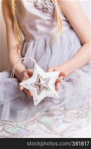 Christmas - children's hands girl holding a star