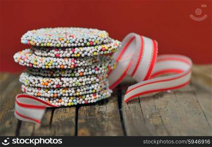 Christmas chocolate Sprinkle and ribbon on old table