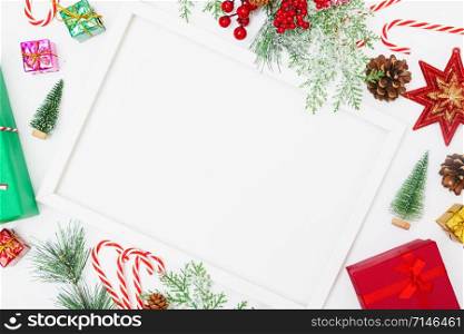 Christmas composition decorations, fir tree branches with Photo square frame on white background. Merry Christmas concept. Copy space for text