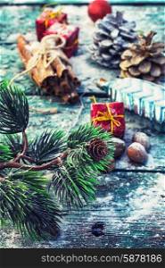 Christmas composition.. decorations for Christmas on wooden background strewn with pine cones and spices.Selective focus
