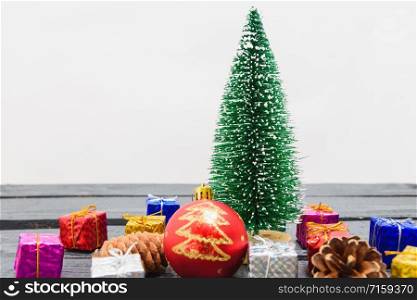 Christmas composition decorations, minimal green fir tree branches with snow and gift boxs on white background. Merry Christmas concept. Copy space for text