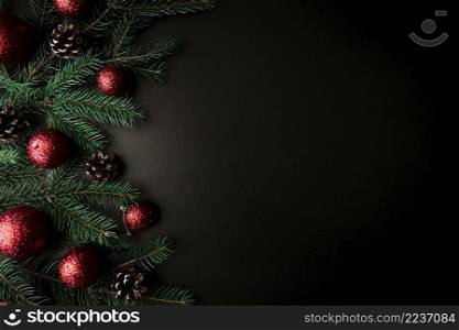 christmas composition fir tree branches with red baubles