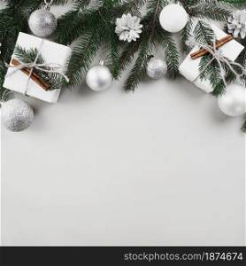 christmas composition fir tree branches with silver baubles