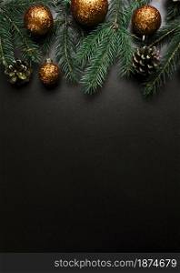 christmas composition green fir tree branches with gold baubles