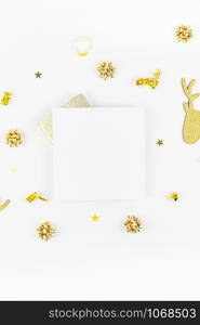 Christmas composition. New Year or Christmas pattern flat lay top view Xmas holiday celebration deer decorative golden frame mockup on white background with copy space. Template of greeting card