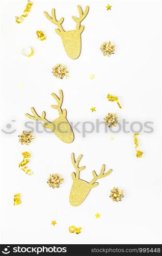 Christmas composition. New Year or Christmas pattern flat lay top view Xmas holiday celebration deer decorative golden frame on white background with copy space. Template of greeting card