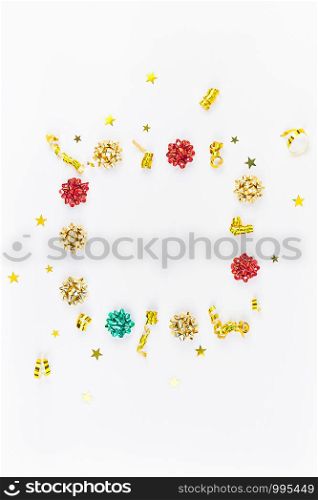 Christmas composition. New Year or Christmas pattern flat lay top view Xmas holiday celebration decorative golden square frame on white background with copy space. Template of greeting card