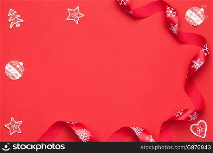 Christmas composition on red paper background. Copy space. Top view